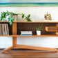 An open, cantilevered display credenza
