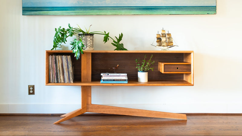 An open, cantilevered display credenza